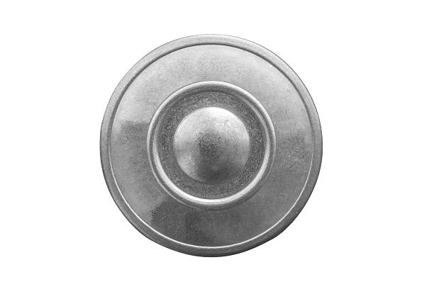 Old metal jeans button isolated on white background