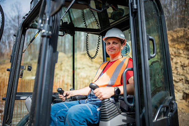 An operator actively engages with the control system that sorts the waste materials