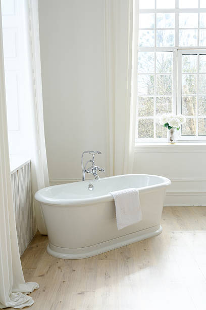 istock Freestanding White Bathtub in Elegant Interior 2207412144