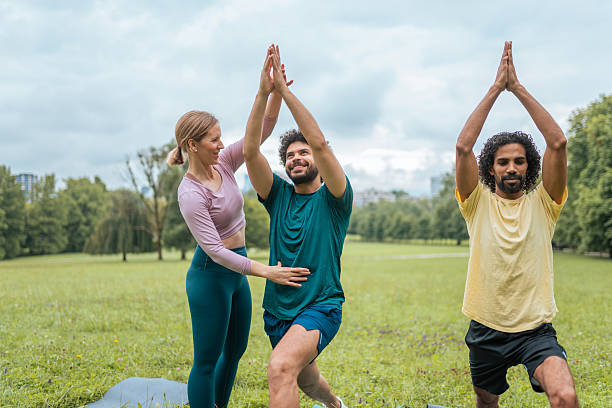 istock Diverse Group Engages in Outdoor Yoga Session 2207413047