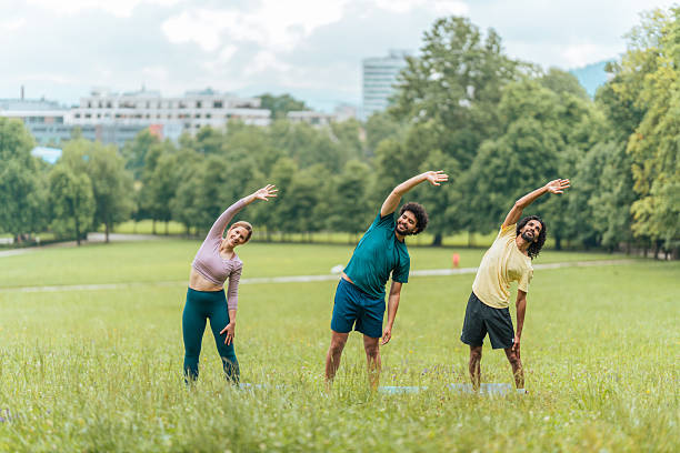 istock Diverse Outdoor Yoga Session with Instructor 2207413049