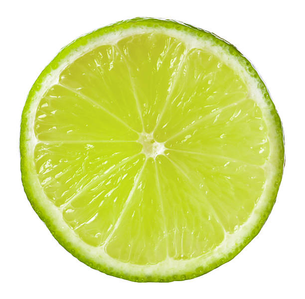 istock Citrus fruit. Slice of fresh lime isolated on white 2207413496