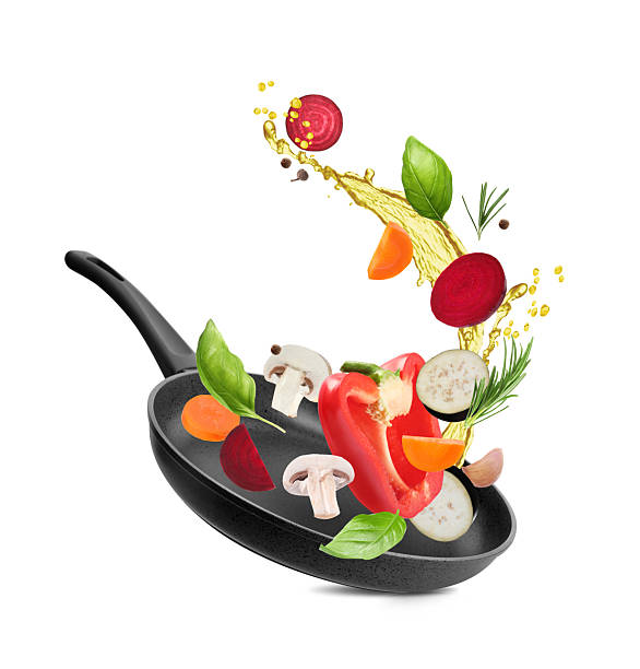 istock Different vegetables, oil, frying pan in air on white background 2207413919