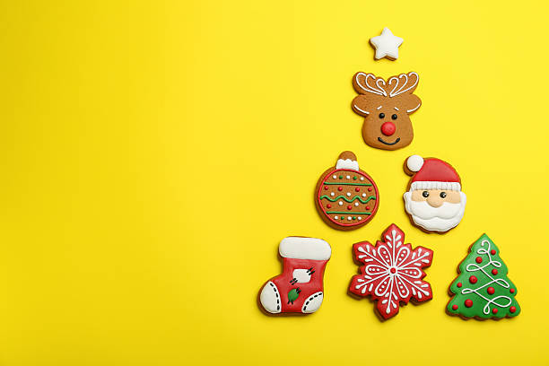 istock Different tasty Christmas cookies on yellow background, flat lay. Space for text 2207413998