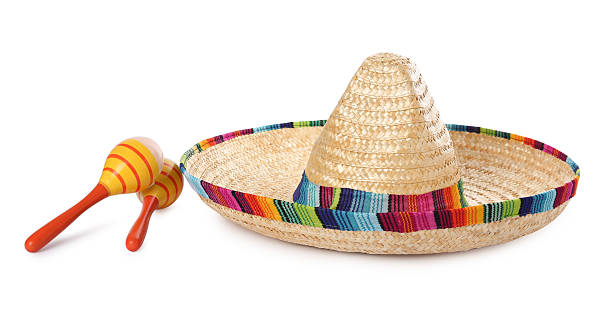 istock Mexican sombrero hat and maracas isolated on white 2207414239