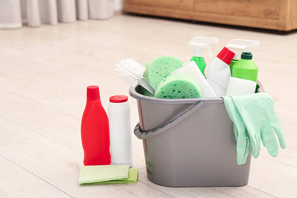 istock Different cleaning supplies in bucket on floor 2207415539