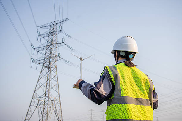 istock asian female engineer using digital tablet in power station 2207425915