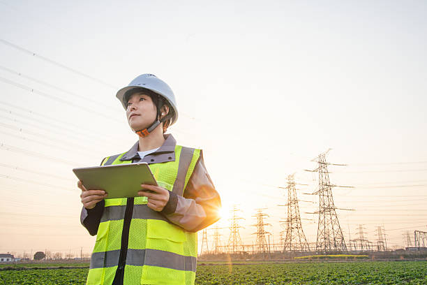 istock asian female engineer using digital tablet in power station 2207430862