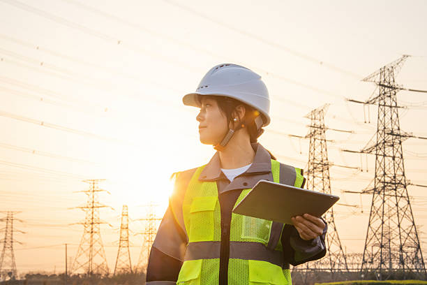 istock asian female engineer using digital tablet in power station 2207430863