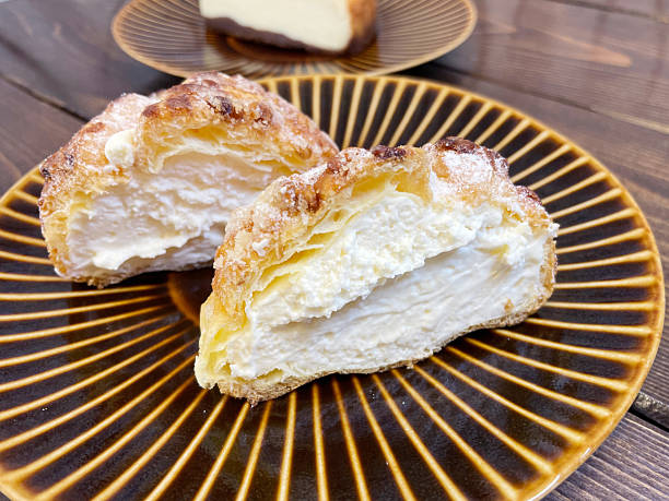 istock Whipped cream puffs with custard 2207433923