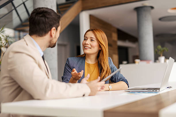 istock Portrait of leaders sitting at boardroom and discussing project. 2207433996
