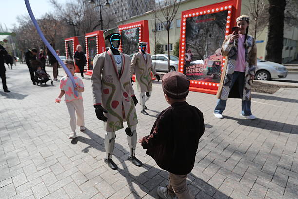 Robots in national dress walk the streets of Almaty in honor of the Nauryz holiday in Kazakhstan.