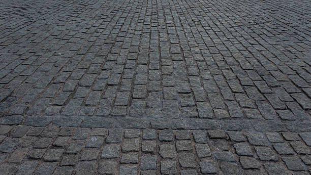 istock Close up cobblestone pavement, Granite cobblestoned pavement background. 2207436466