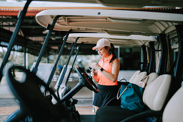 istock Asia Chinese female golfer drinking water getting ready in golf course weekend morning 2207439941