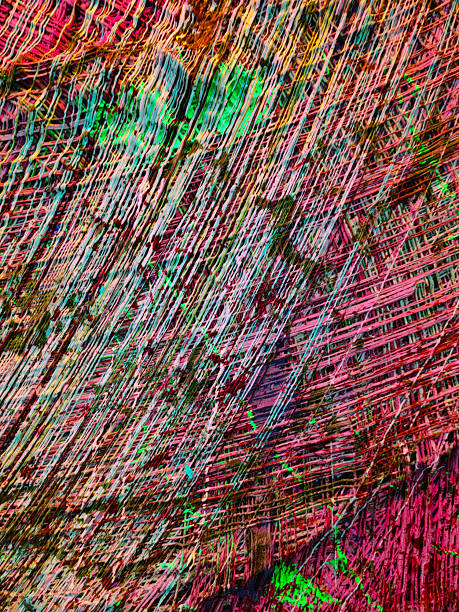 Close-up of multicolored paper curved stripes abstract forming background.