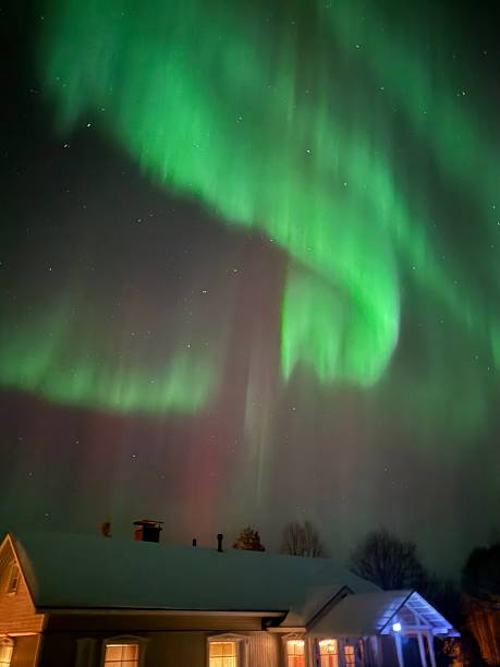 istock Aurora Borealis Over a Snowy Lapland Cabin 2207443797