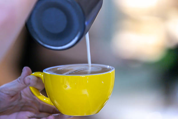 istock Young barista woman is preparing latte. 2207448073