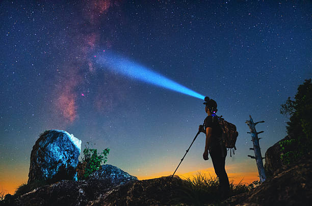 istock Hiking lighting under the starry sky 2207450411