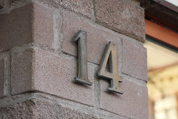 istock The number fourteen on a brick wall 2207453223