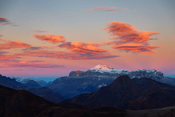 Awesome morning sun illuminates the clouds in red color. Location place pass di Giau, Dolomiti Alps, South Tyrol, Italy, Europe. Scenic image of tourist attraction. Discover the beauty of earth.