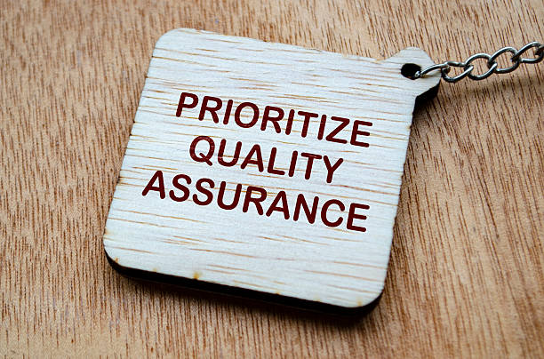 istock Top view of Prioritize Quality Assurance text on wooden blocks. Quality control concept. 2207454964