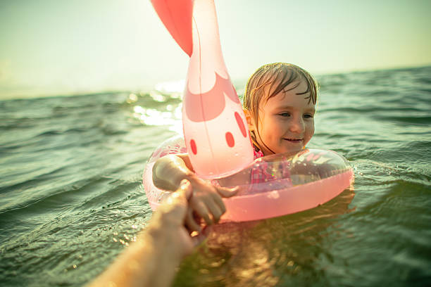 istock Family enjoying beach holidays 2207456175