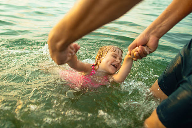 istock Family enjoying beach holidays 2207456199