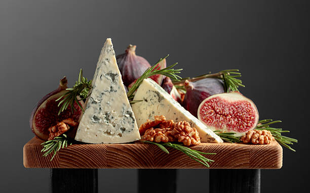 istock Blue cheese with figs, walnuts, and rosemary. 2207456915