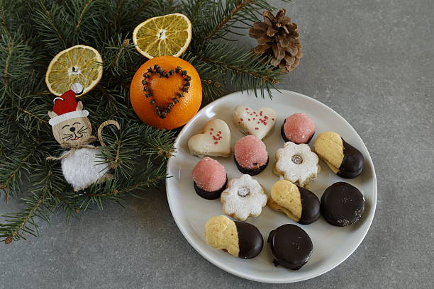 istock Christmas cookies with festive decorations and pine branches 2207457215