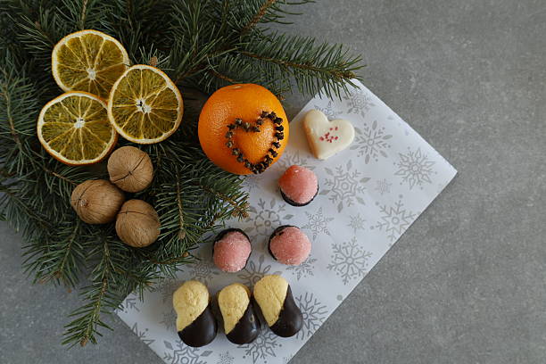 istock Christmas cookies with walnuts and pine branches on festive paper 2207457344