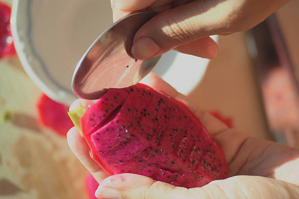 istock Preparing Fresh Dragon Fruit for Your Enjoyment and Culinary Delight 2207462606