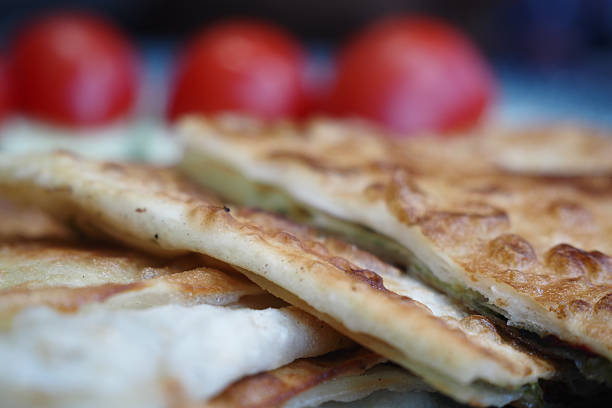 istock A Tasty and Delicious Flatbread Topped with Fresh Tomatoes Served on a Plate 2207462673