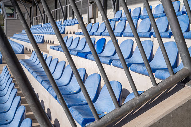 istock Empty blue stadium seats waiting for the crowd to cheer 2207466646