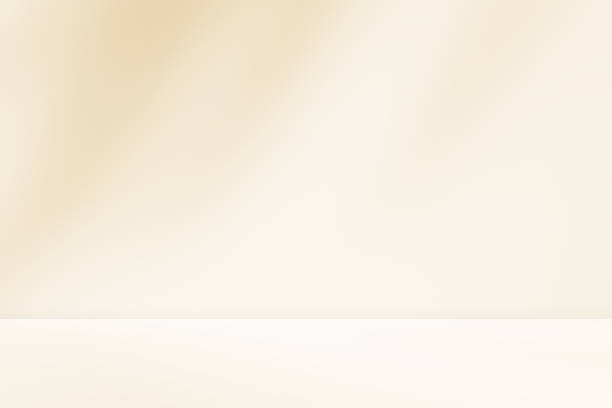istock Empty cream beige room studio with shadow of leaves for product presentation. 2207467993