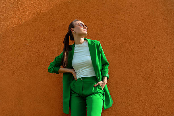 istock Young businesswoman enjoying summer sunlight, low angle view 2207474137