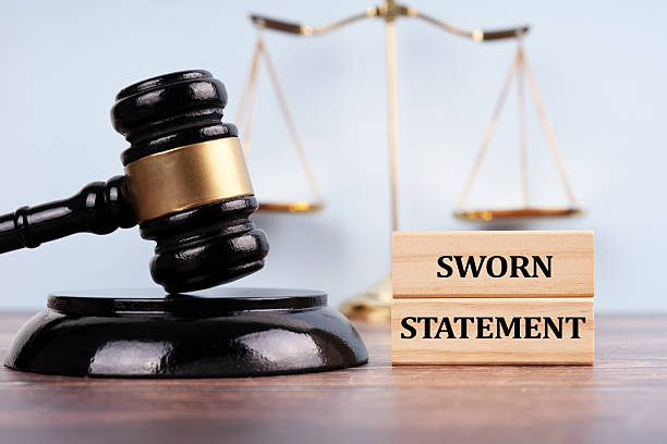 istock Judge's gavel and stick with the word SWORN STATEMENT. Justice concept 2207475683