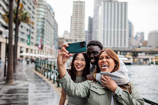 istock Friends Sharing a Selfie with Sydney Harbor Views 2207476616