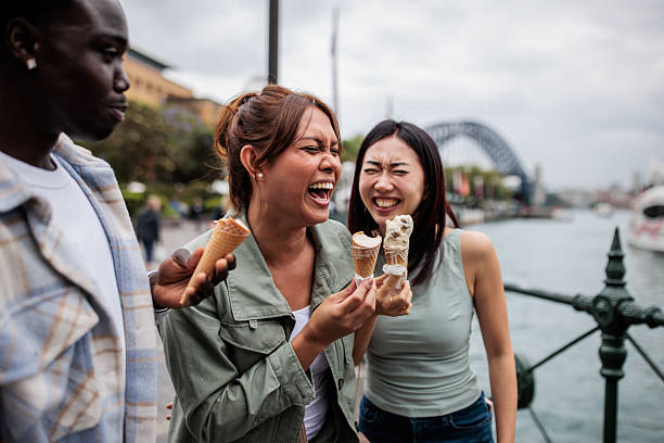 istock Diverse Friends Enjoying Ice Cream by Sydney Harbor 2207476716