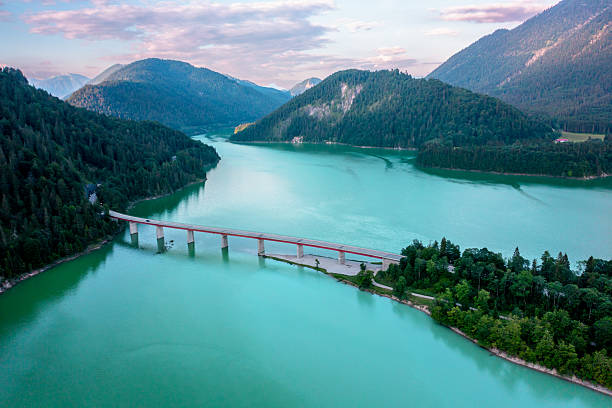 istock Drone image with the Sylvenstein Lake surrounded by mountains, in Upper Bavaria, Germany 2207479924