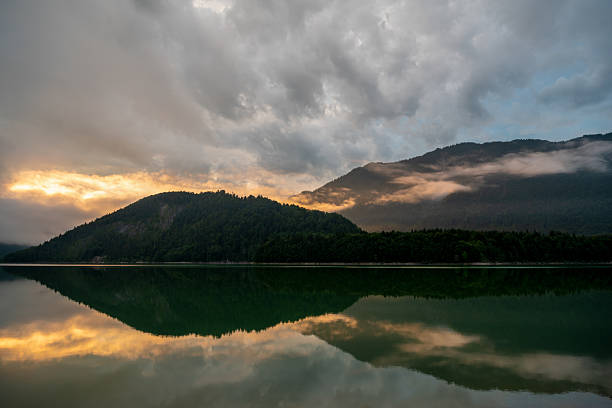 istock Sunset in the Karwendel Mountains, reflection in Lake Sylvenstein. 2207482814