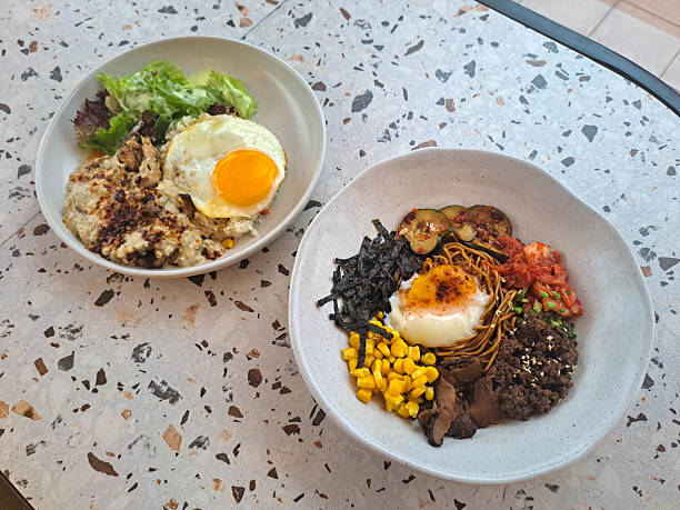 istock Fried Dry Ramen Noodle With Minced Beef, Onsen Egg, Shitake Mushroom, Corn, Nori, Kimchi, Pickled Cucumber And Spring Onion. Szechuan Mushroom Grilled Chicken With Mushroom Butter Rice, Chicken Leg, Creamy Mushroom Sauce, Garlic Chili Oil, Sunny Side Up. 2207484768