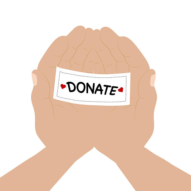 istock A man holding a heart-shaped piece of paper with a donation note written on it in his palm 2207484931