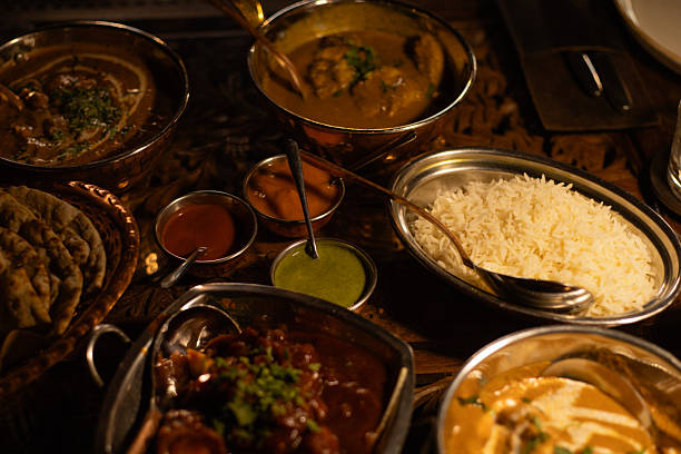 istock various Indian dishes on the table in plates 2207485444