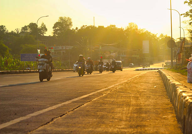 Motorized vehicles on the road in the afternoon