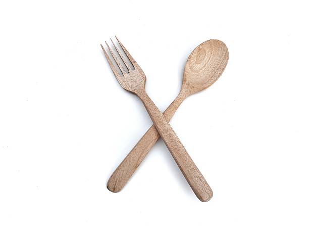 istock Wooden spoon and fork isolated on white background 2207493359