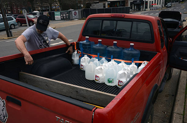 People collecting free spring water from the water of Hot Springs in Hot Springs, Arkansas on February 08, 2025