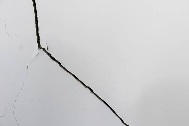 istock Damaged Building Wall and Earthquake Damaged Building StructureCracked Wall ,Diagonal Cracks 2207494280