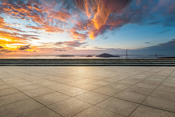 istock Brick floor and islands with dramatic cloudscape background at sunset 2207495417