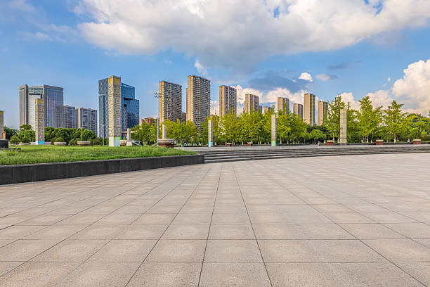 istock Modern city skyline and empty floor with green trees 2207495508