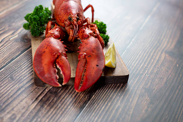 Red lobster on wooden cutting board